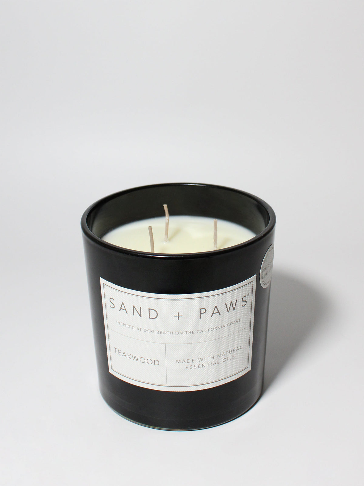 Sand + Paws Teakwood 21 oz aromatic scented candle
